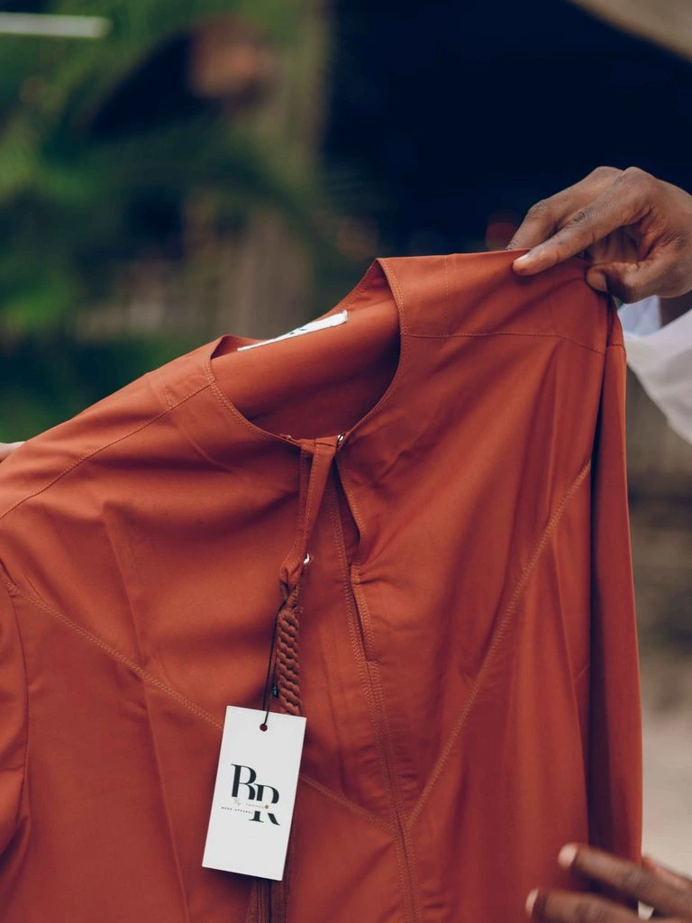 Fear Not type lockup tee in rust orange, lifestyle view